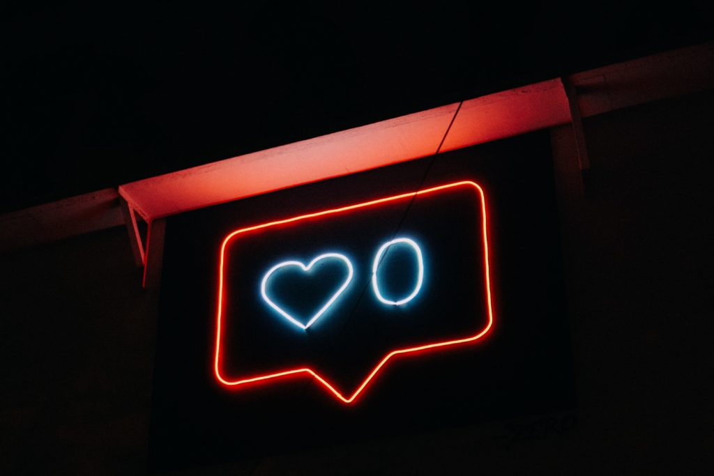 Content marketing advice on how to improve content performance. Photo shows an unloved neon sign with zero likes